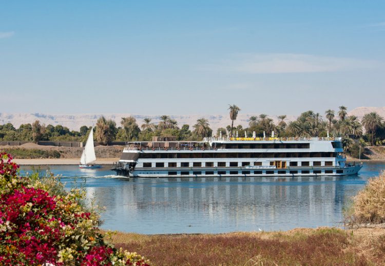 River boat cruising down the Nile at Luxor in Egypt