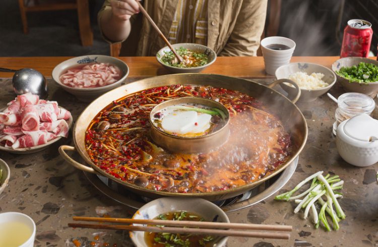 A person is eating hotpot scene in Sichuan, China